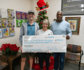 Fleet Feet Makes Charitable Donation to the Play for All Foundation